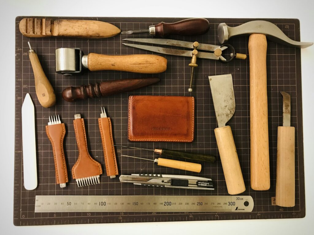 Leather craft tools on a cutting board (placeholder, Unsplash / Joel Lee)